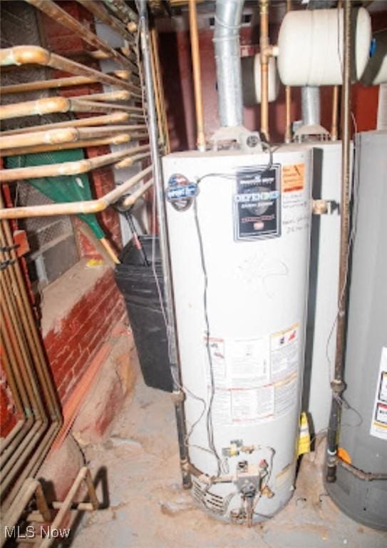 utility room featuring gas water heater