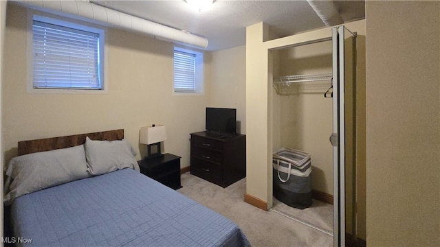 carpeted bedroom featuring a closet