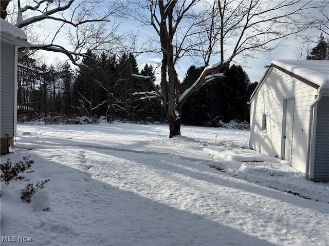 view of yard covered in snow