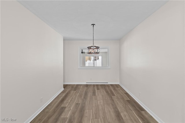 unfurnished dining area with hardwood / wood-style floors