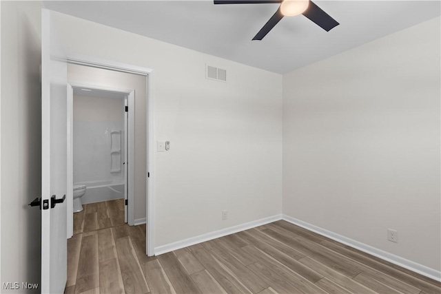 unfurnished room featuring ceiling fan and light hardwood / wood-style flooring