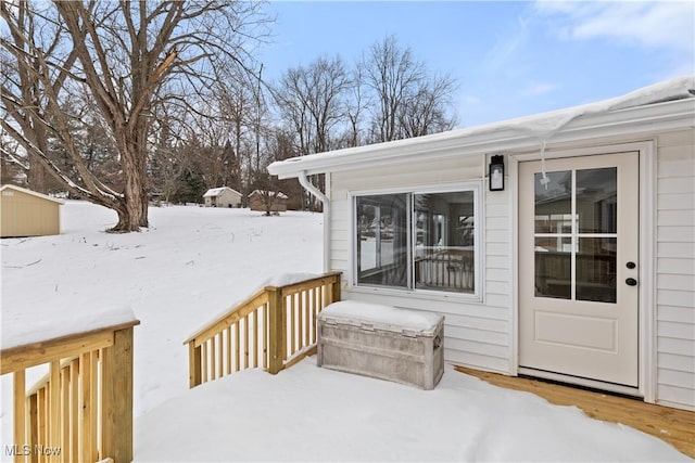 view of snow covered deck