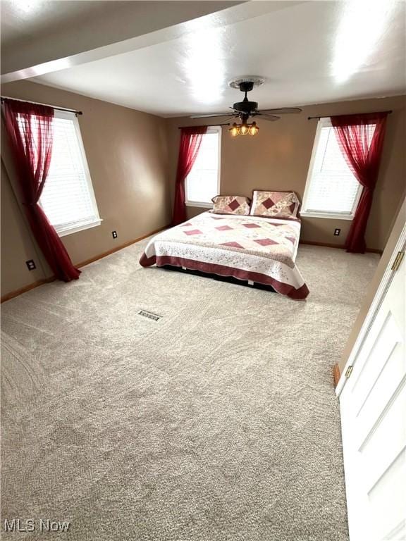 unfurnished bedroom featuring carpet and ceiling fan