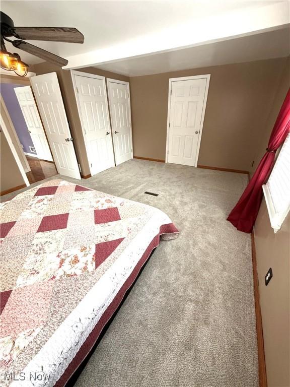 bedroom with ceiling fan and carpet floors