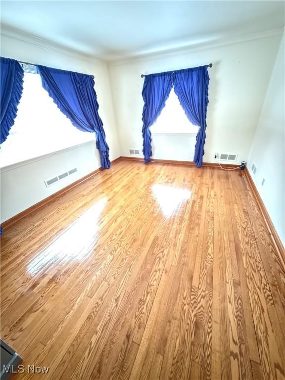 empty room featuring hardwood / wood-style floors