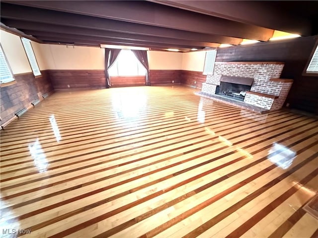 interior space featuring a brick fireplace and wooden walls