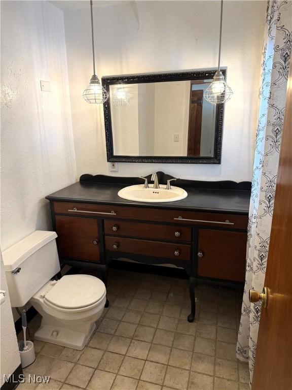 bathroom with vanity and toilet