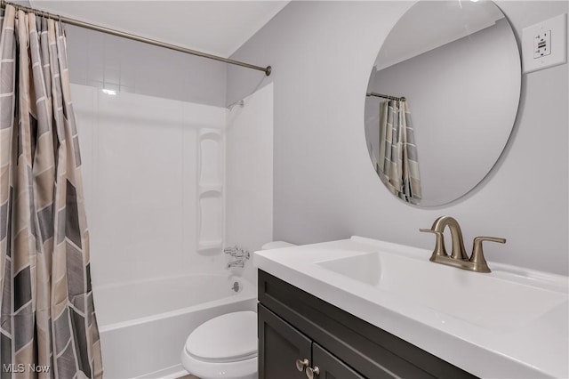 full bathroom featuring vanity, toilet, and shower / bathtub combination with curtain