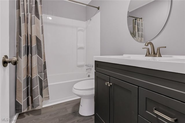 full bathroom with vanity, wood-type flooring, shower / bath combo, and toilet