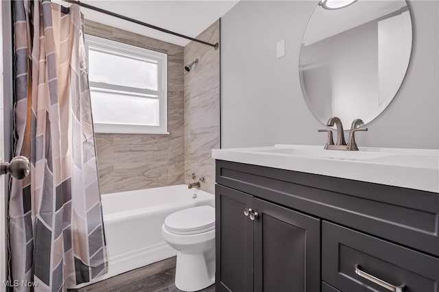 full bathroom with toilet, vanity, shower / bath combination with curtain, and hardwood / wood-style flooring