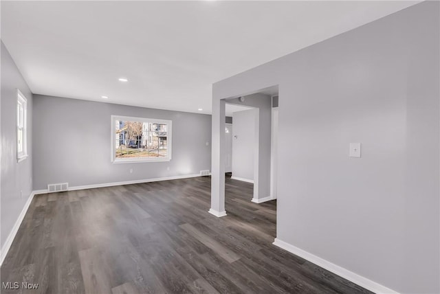 spare room featuring dark hardwood / wood-style flooring