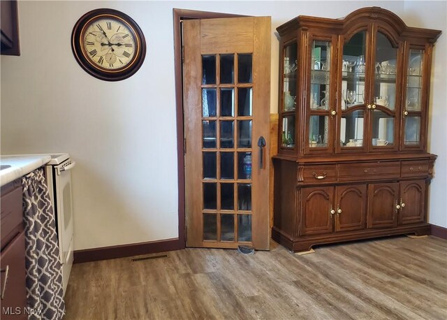 unfurnished dining area featuring light hardwood / wood-style floors