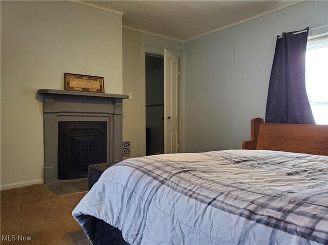 bedroom featuring ornamental molding and carpet flooring