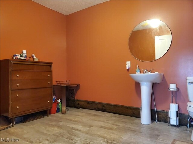 bathroom featuring toilet and sink