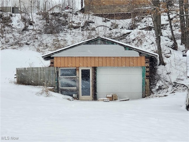 view of snow covered garage