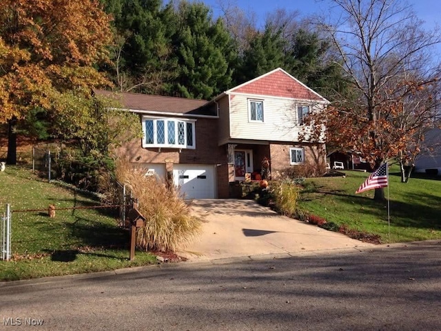 view of front of house with a front lawn and a garage