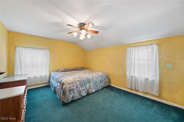 carpeted bedroom with ceiling fan and lofted ceiling