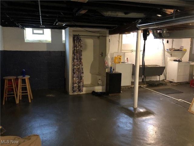 basement with separate washer and dryer