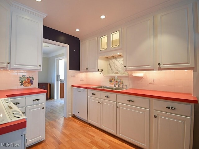 kitchen with white cabinetry, sink, wood counters, white dishwasher, and light hardwood / wood-style floors