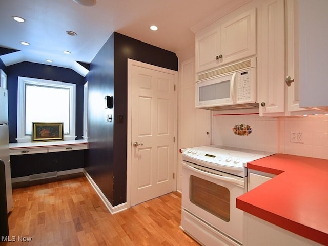 kitchen featuring white cabinets, white appliances, and light hardwood / wood-style floors