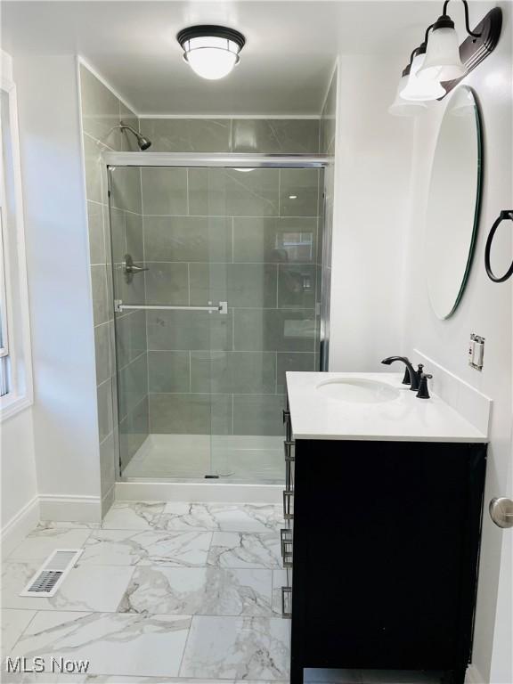 bathroom with vanity and an enclosed shower