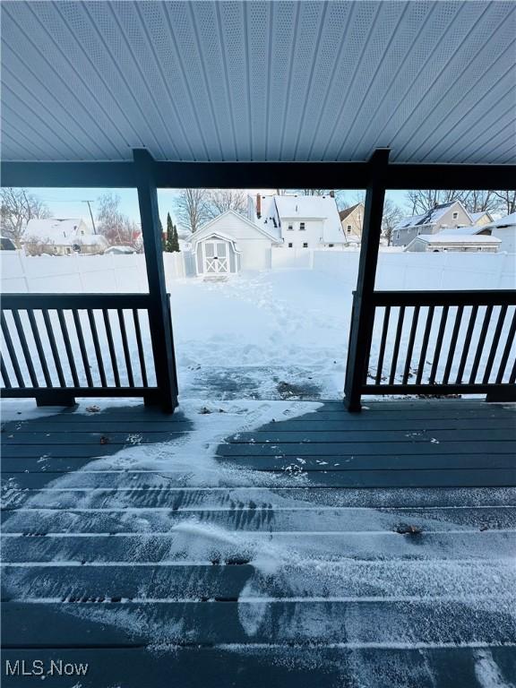 view of snow covered deck