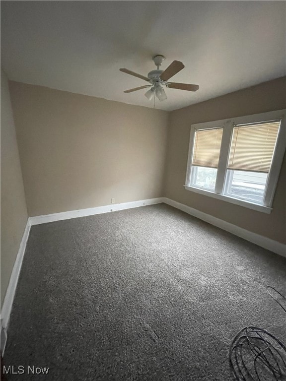 unfurnished room featuring carpet and ceiling fan