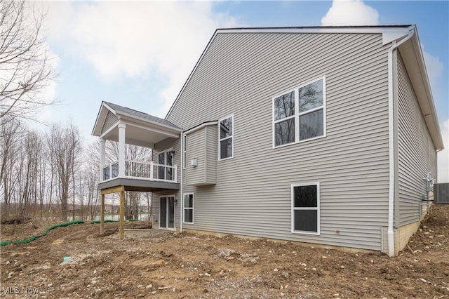 back of property with a deck