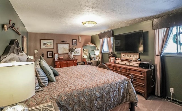 carpeted bedroom featuring a textured ceiling