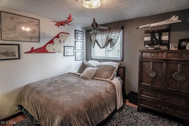 bedroom featuring a textured ceiling