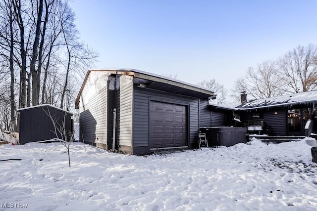 view of snow covered garage