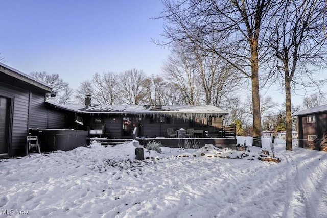 view of snow covered house