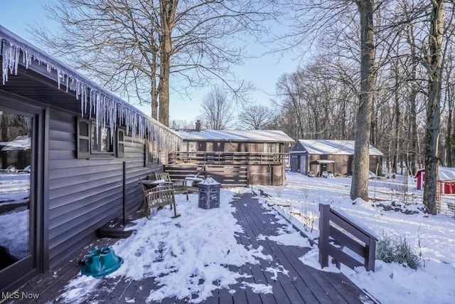 snowy yard with a wooden deck