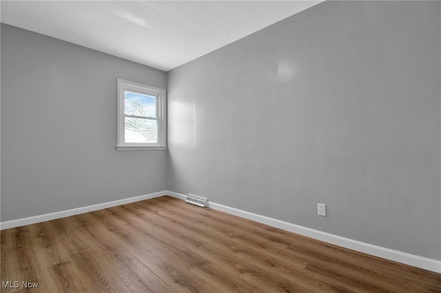 empty room with light hardwood / wood-style floors