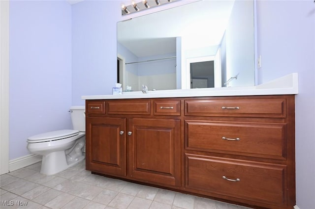 2142 Kirtland Pl, Hudson, OH 44236 - bathroom featuring toilet, vanity, tile patterned floors, and baseboards