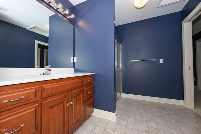 bathroom featuring vanity and an enclosed shower