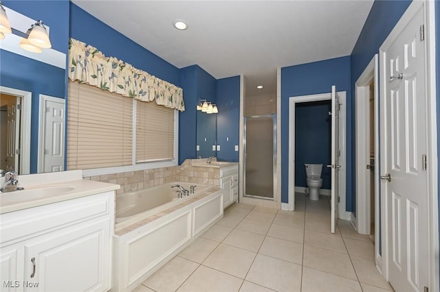 full bathroom with toilet, shower with separate bathtub, vanity, and tile patterned floors