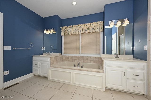 2142 Kirtland Pl, Hudson, OH 44236 - full bathroom featuring tile patterned floors, a garden tub, vanity, and baseboards