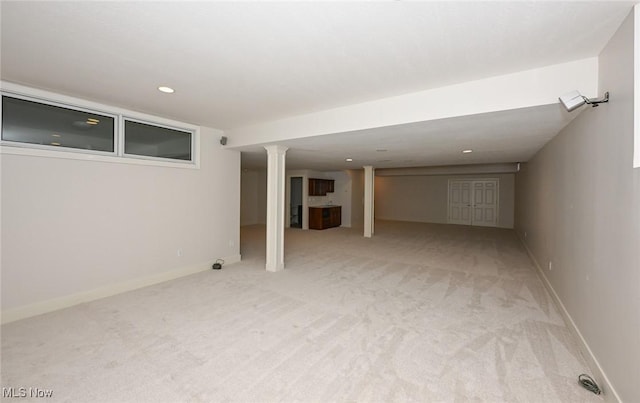 basement with light colored carpet