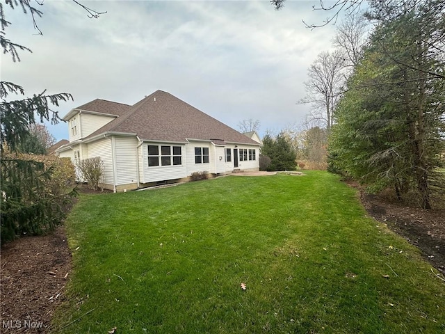 rear view of house with a lawn