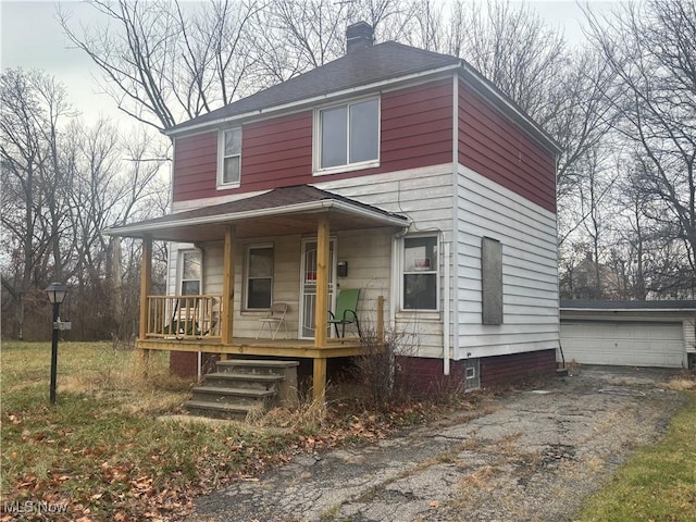 view of front of house with covered porch and a garage