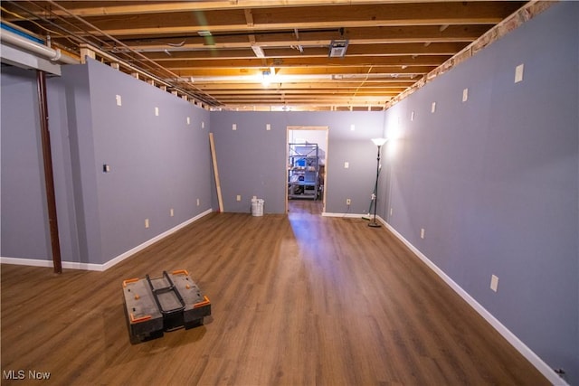 basement featuring hardwood / wood-style floors