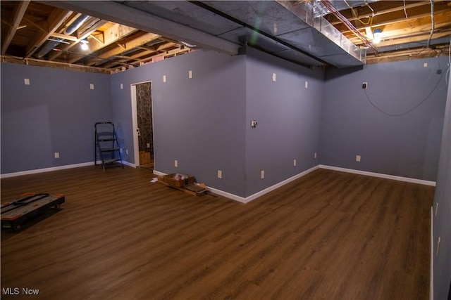 basement featuring dark hardwood / wood-style floors