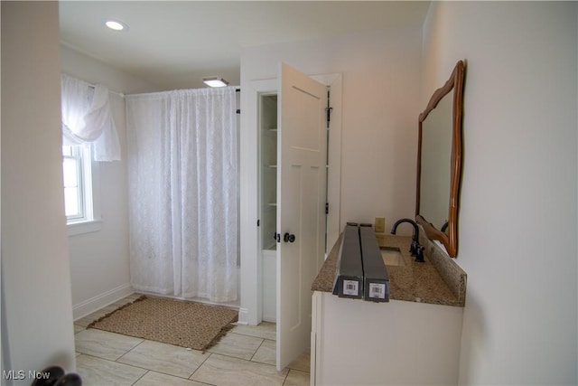 bathroom featuring tile patterned flooring and sink