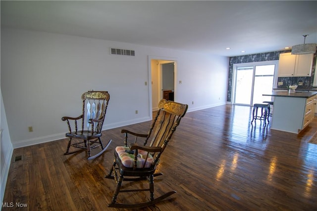 living area featuring dark hardwood / wood-style floors