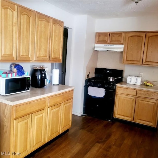 kitchen with dark hardwood / wood-style flooring and black range with gas cooktop