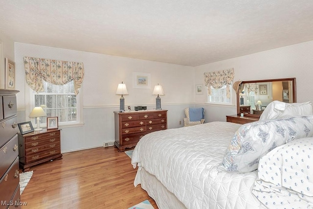 bedroom with hardwood / wood-style floors