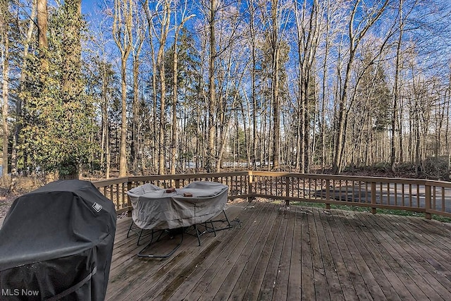 wooden deck featuring grilling area