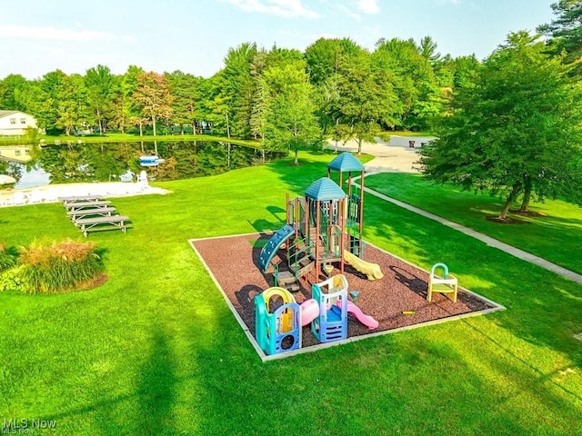 view of play area with a water view and a lawn