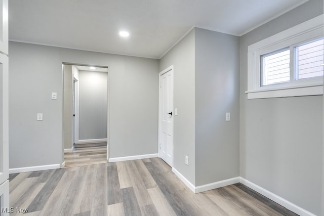 spare room with light hardwood / wood-style floors